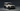 Rendering weißer Land Rover Defender 90 Heritage vor grauem Hintergrund