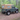 Land Rover Defender 90 Td5 Td4 mit Soft Top Verdeck in sand beige aus Canvas im Wald. Im Hintergrund sind Bäume zu sehen. Das Verdeck hat ein Heckfenster und Seitenfenster. 